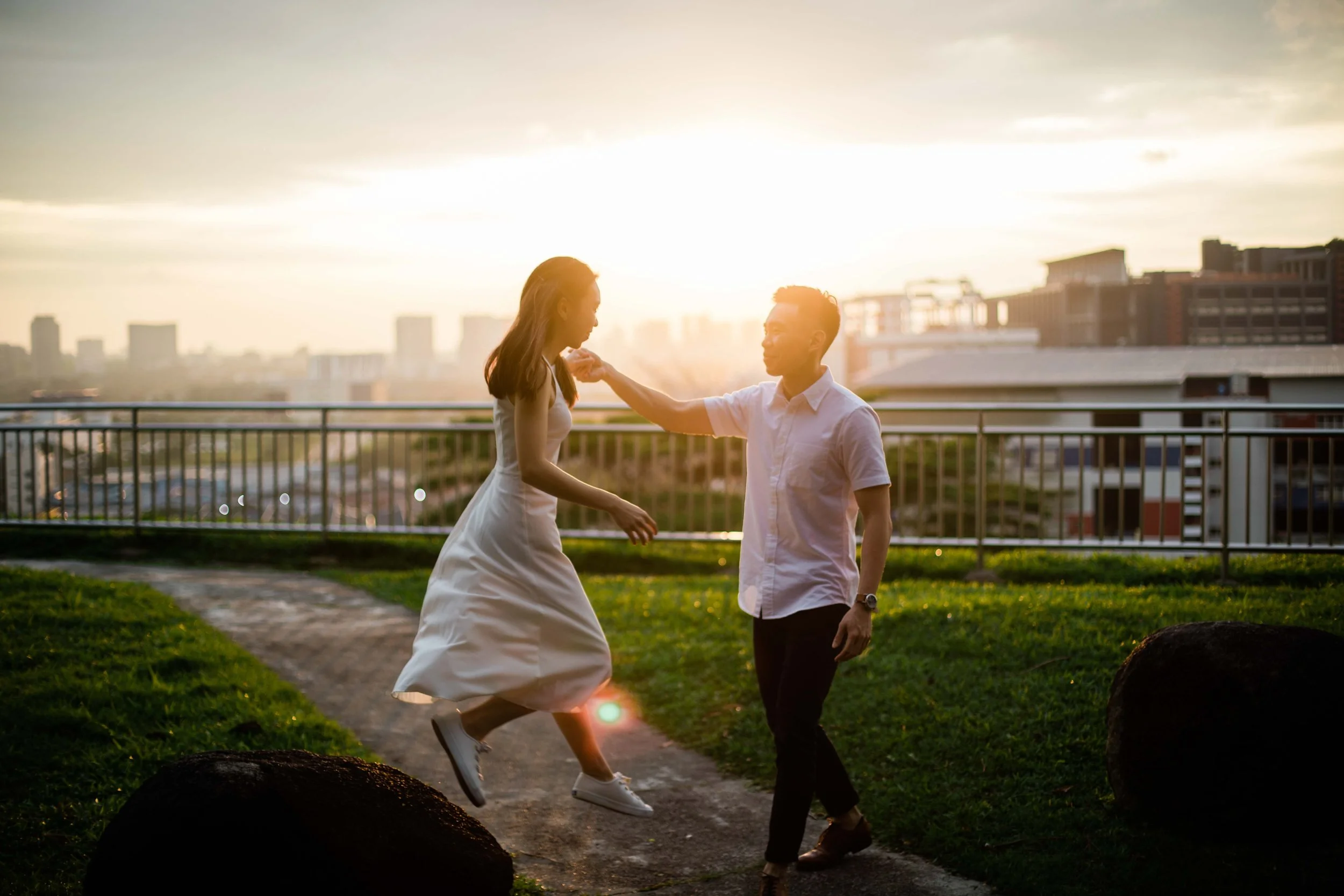 J and D sharing a quiet pre-wedding moment outdoors during their full-day photo shoot in Singapore