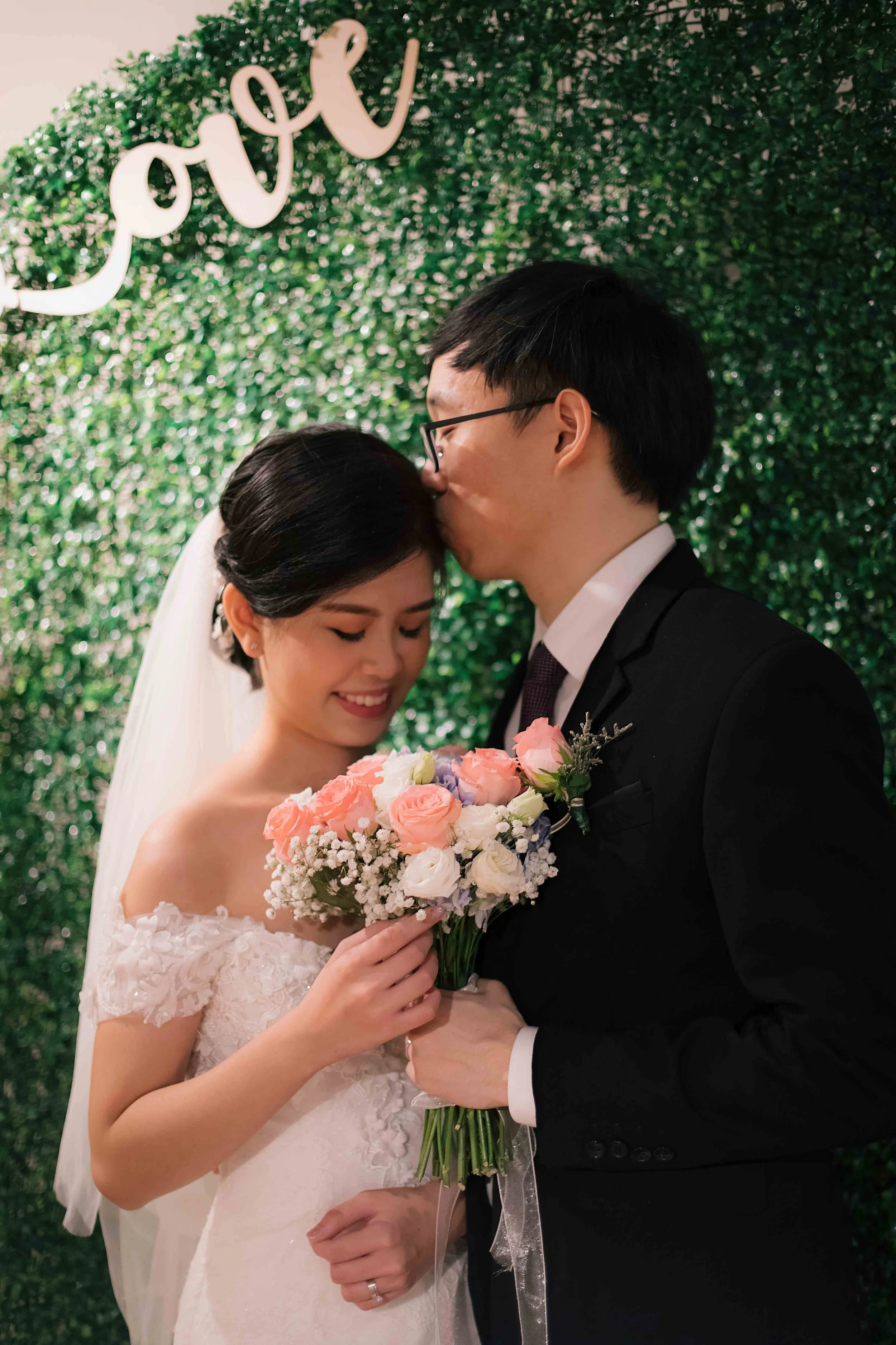 Cy and Jasmine during their actual day wedding ceremony at NTU Alumni Club in Singapore