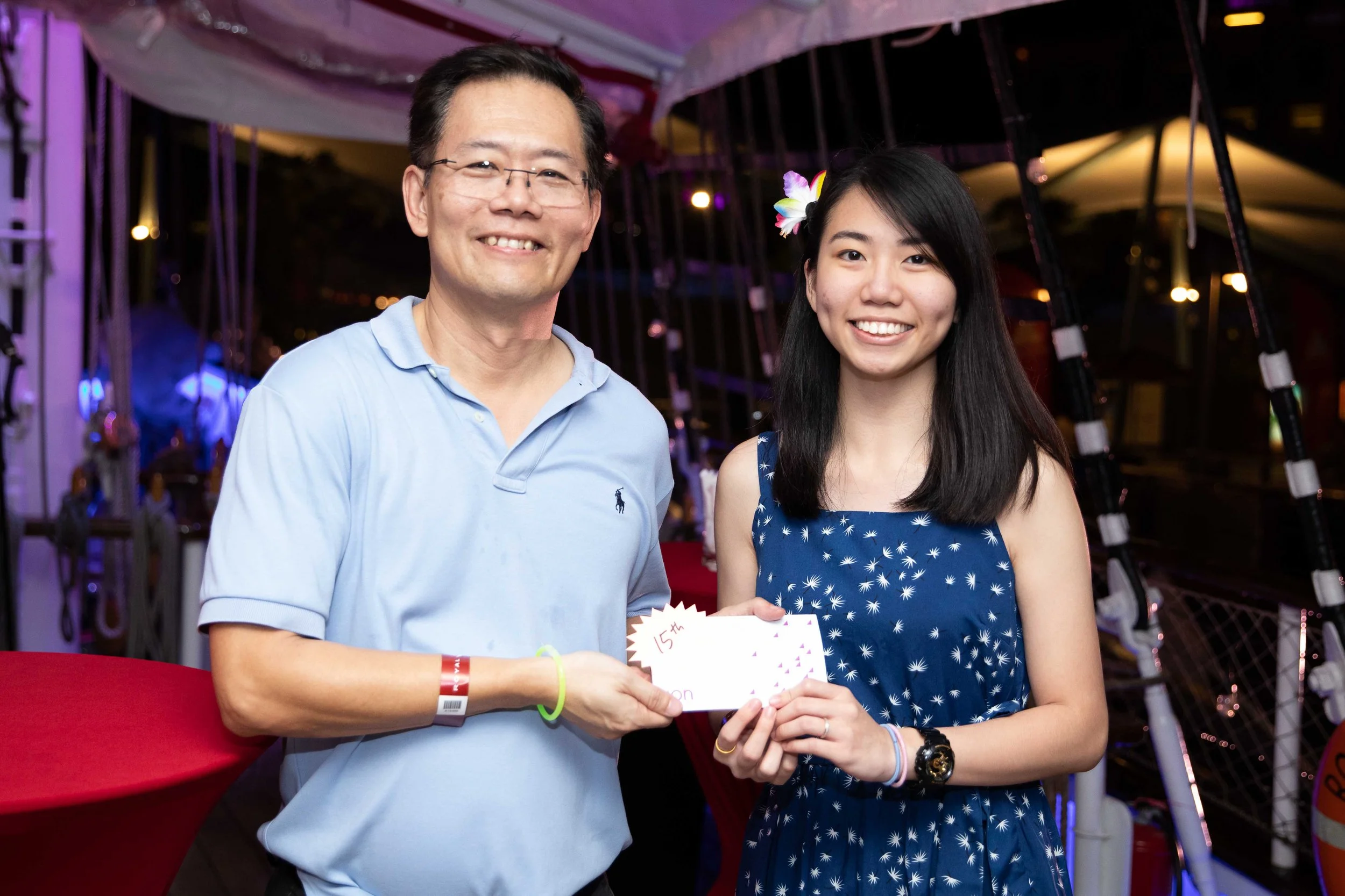 Guests celebrating during Katoen Natie Singapore’s annual dinner and dance on board the Royal Albatross in Sentosa