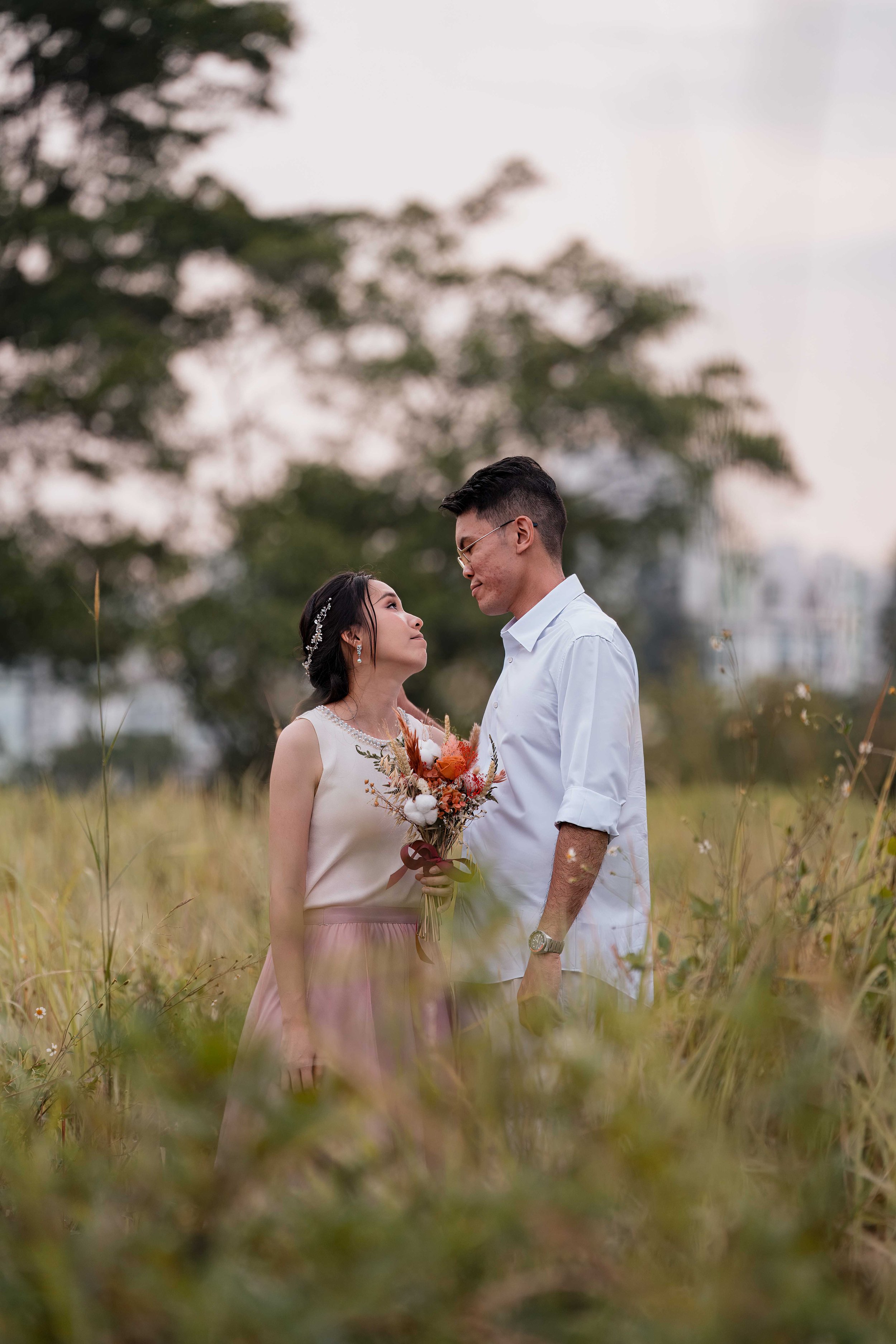 Daniel and Jia Hui sharing a quiet pre-wedding moment during their full-day photo shoot in Singapore