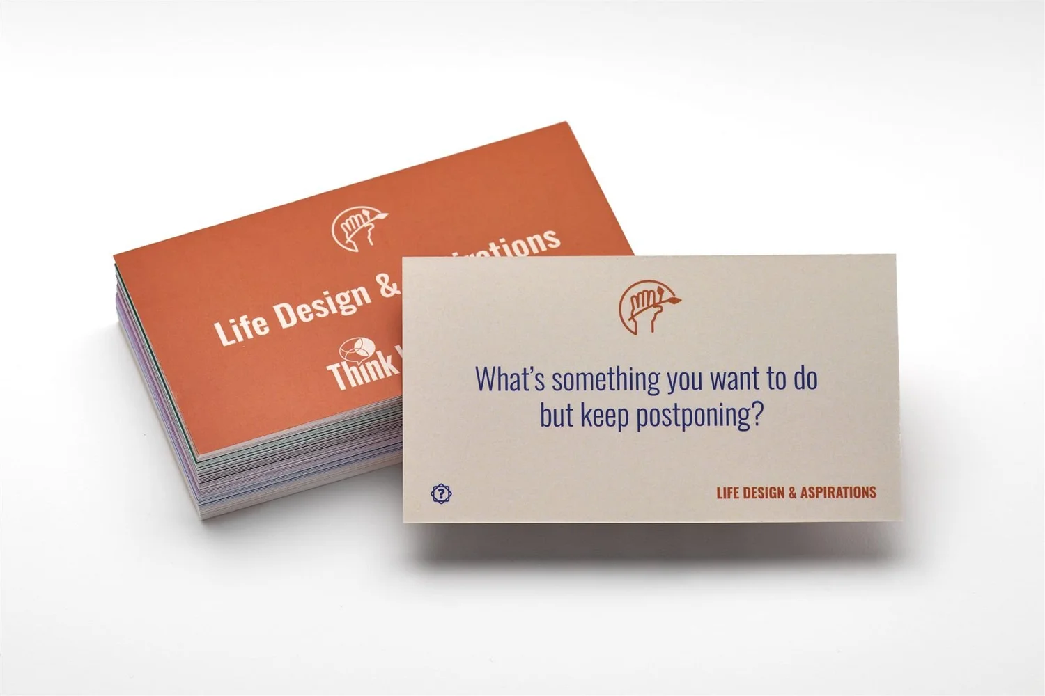A Think Weekend question card on top of a stack of cards