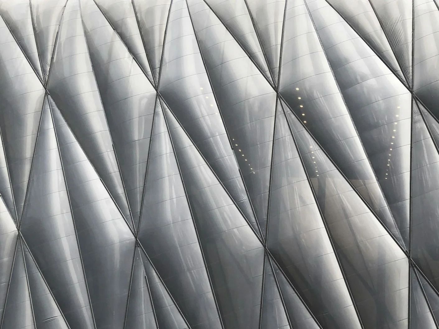 Architectural silver facade — structural geometry reference for sterling silver