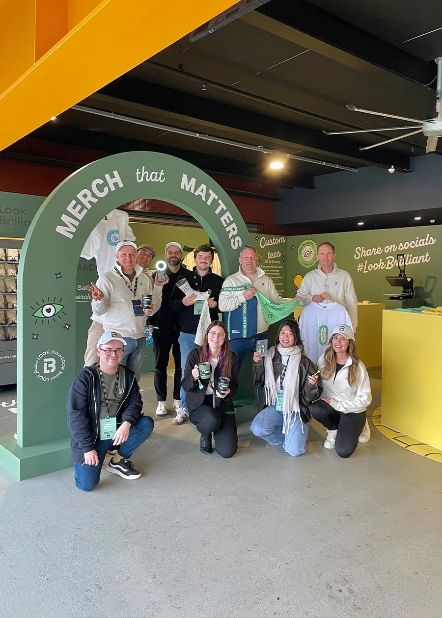 Group of Look Brilliant staff posing next to activation at State of Social