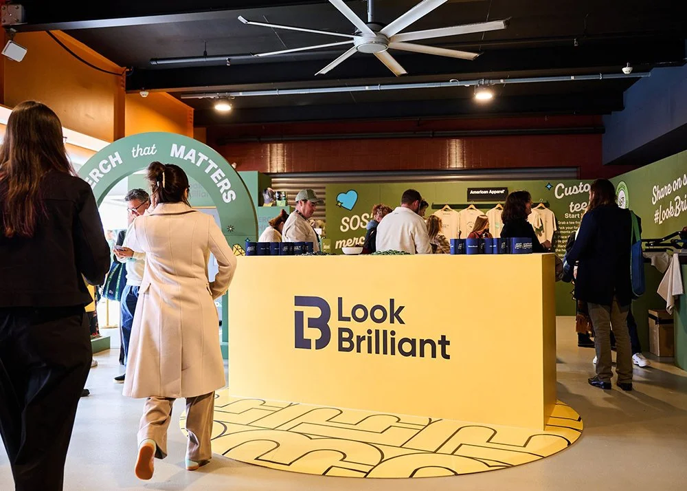 Crowd of people gathering towards Look Brilliant activation