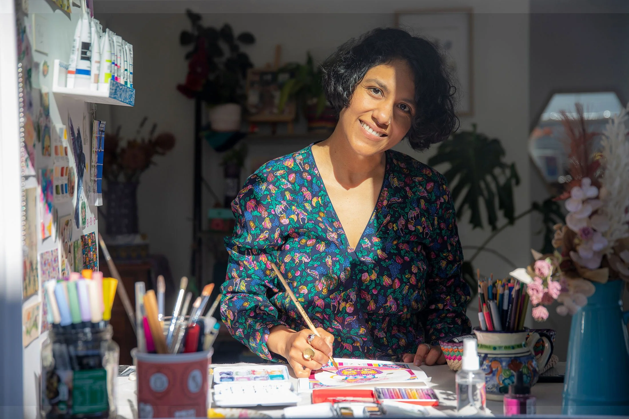 Cris, artist behind Cris Banana Studio, in her Christchurch studio