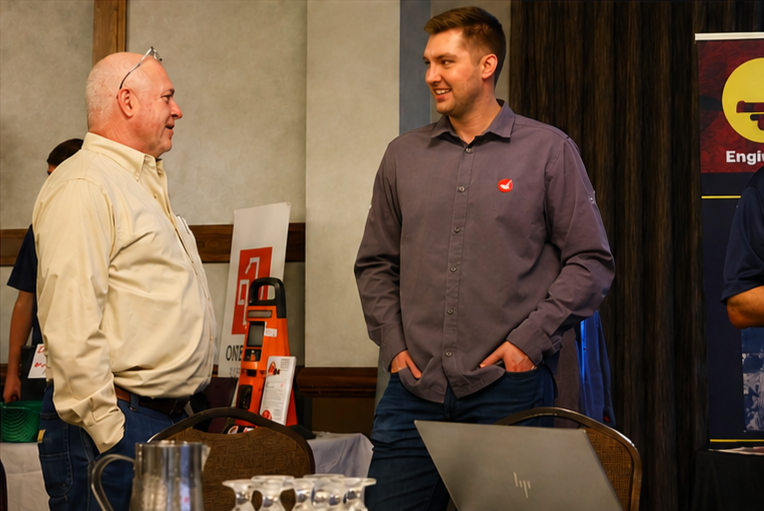 Attendees exploring sponsors and safety solutions at the conference expo
