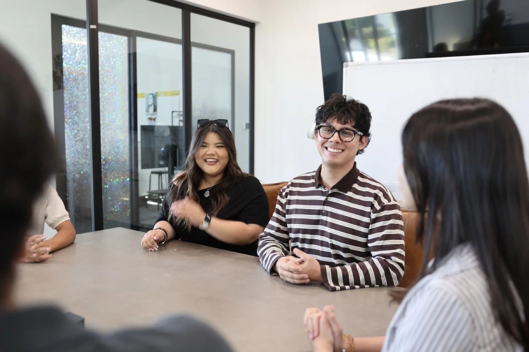 Young Nevada leaders smiling during a group discussion