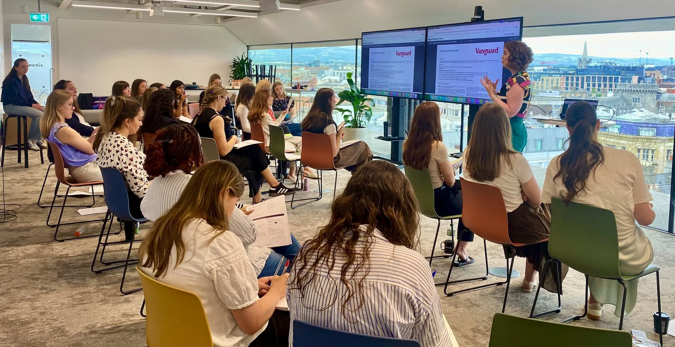 Susan Kilcline walking a full room of women through a live investing platform at a corporate workshop in Dublin