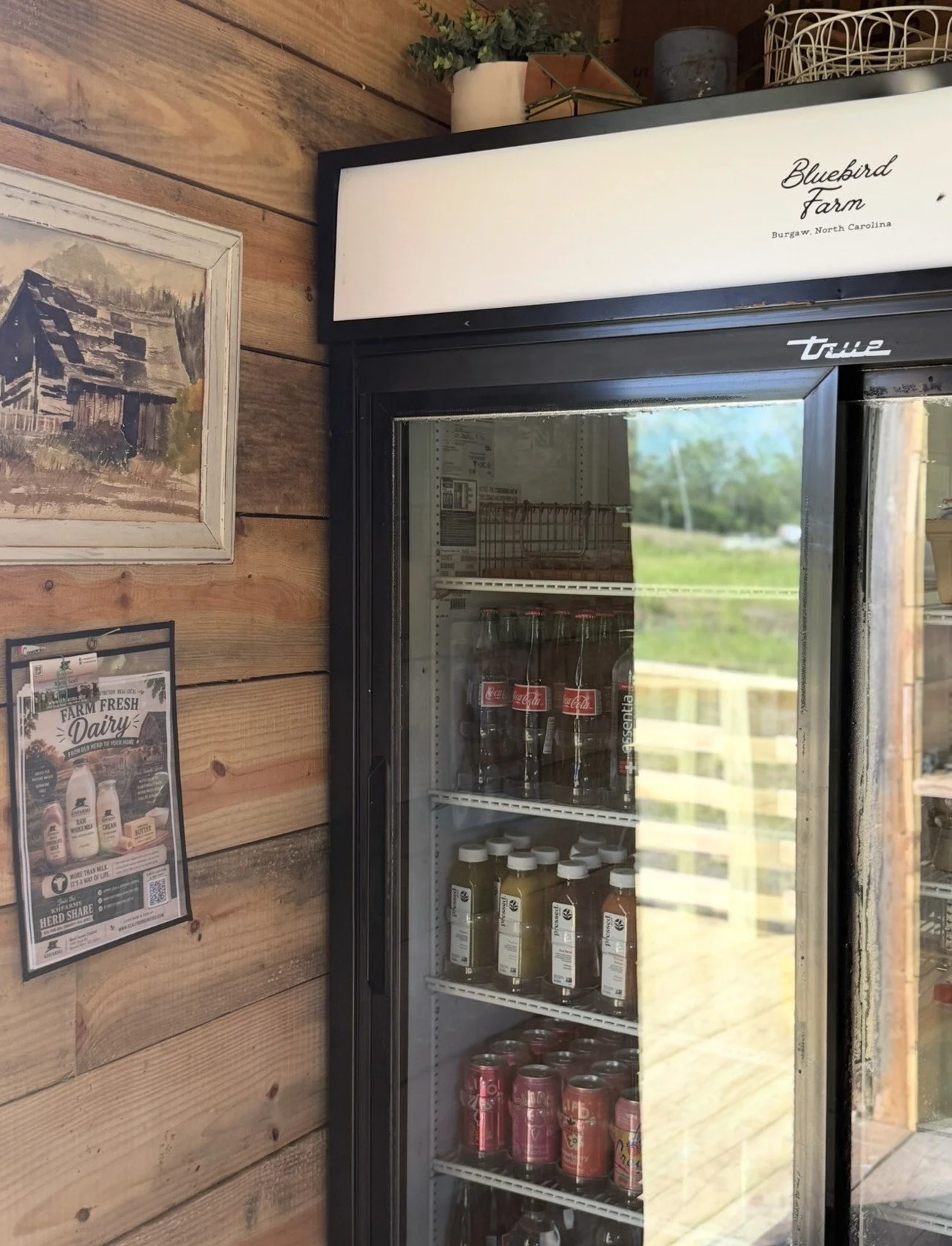 The Bluebird Farm store cooler stocked with milk and drinks