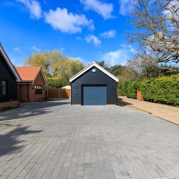 Garage and block paving driveway