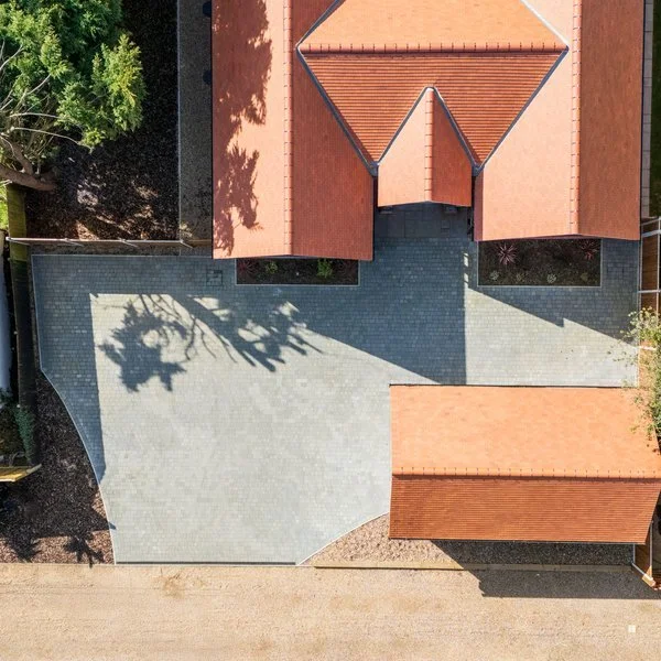 Aerial view of completed driveway and property