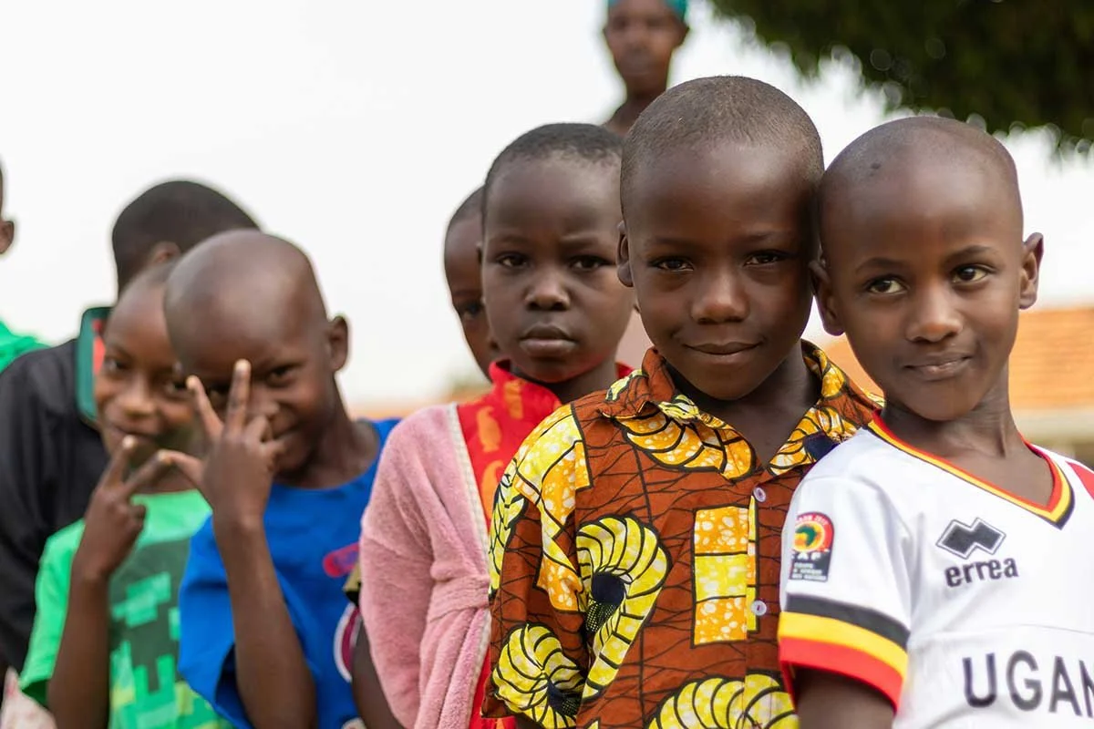 Local community children smiling in a Tanzanian village near wildlife areas