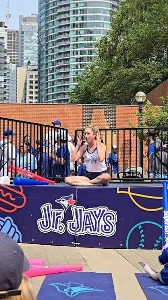 Michelle Faber performs yoga at the Junior Jays stage at the Rogers Centre