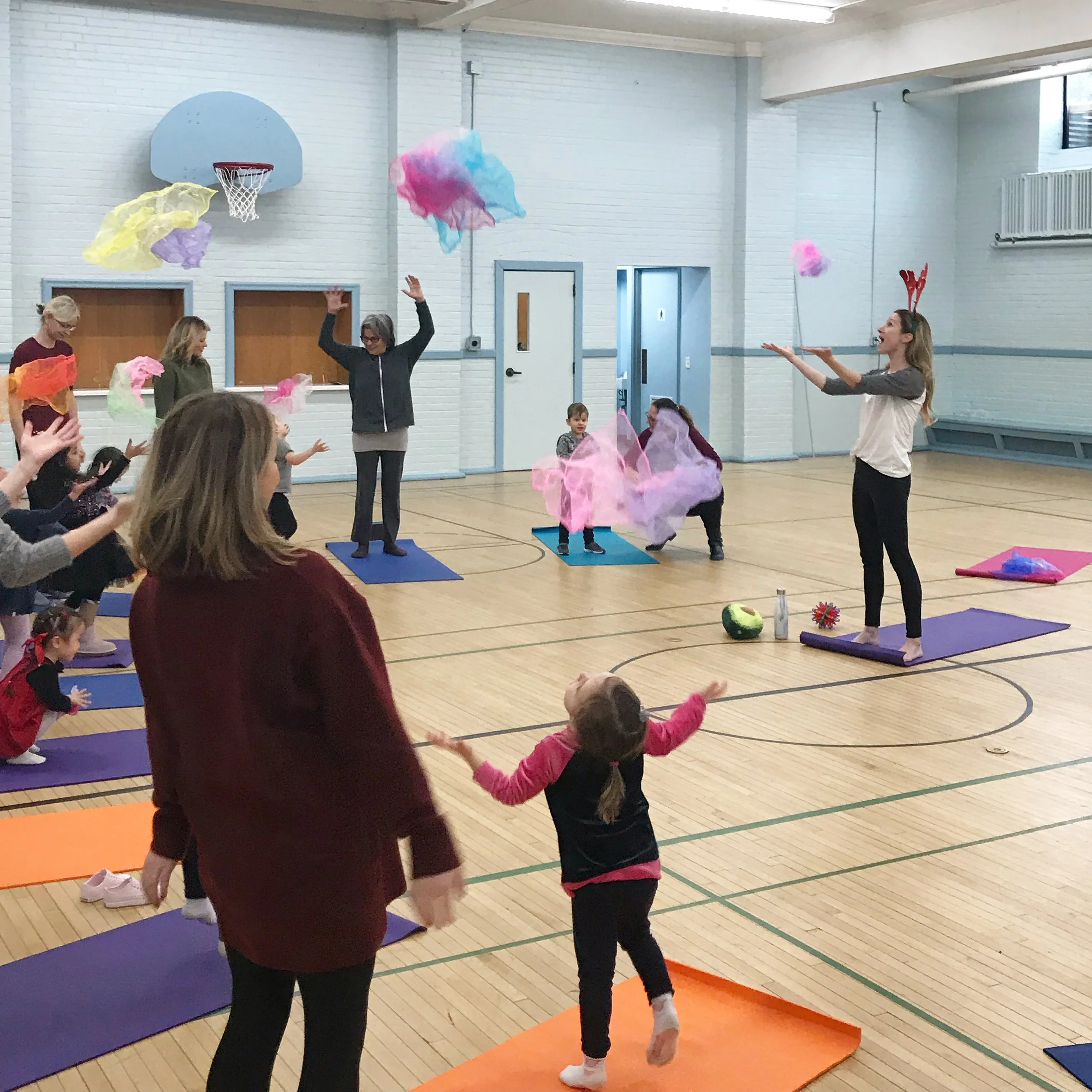 Michelle Faber leading a live outdoor kids' yoga workshop