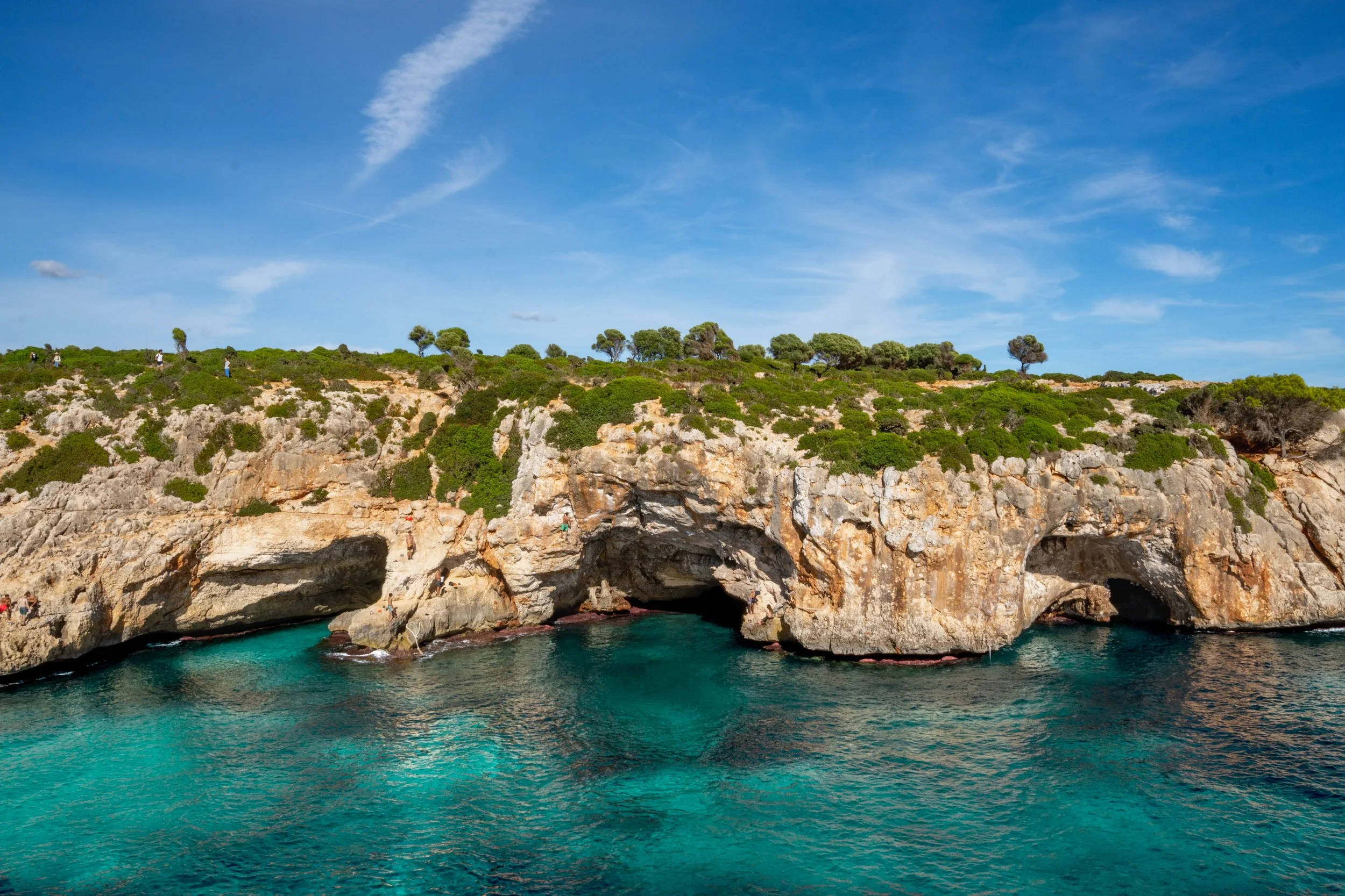 Deep water soloing above the sea at Cala Varques, Mallorca