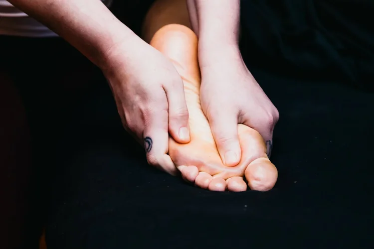 Hand and foot massage in progress
