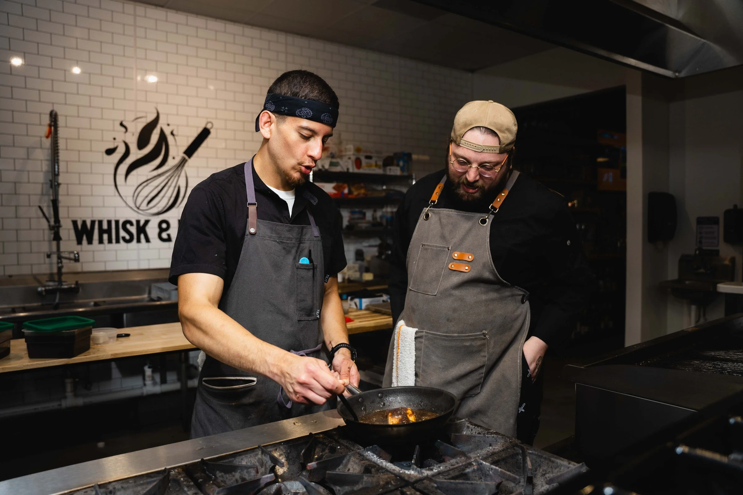 Whisk and Flame chefs cooking in the studio kitchen