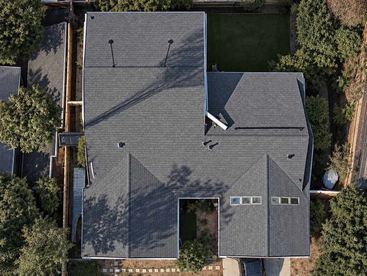 Aerial drone view of a new asphalt shingle roof replacement in the San Fernando Valley
