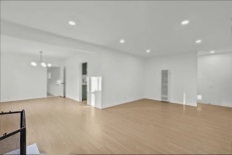 New light wood-look flooring installed in an open living room in the San Fernando Valley