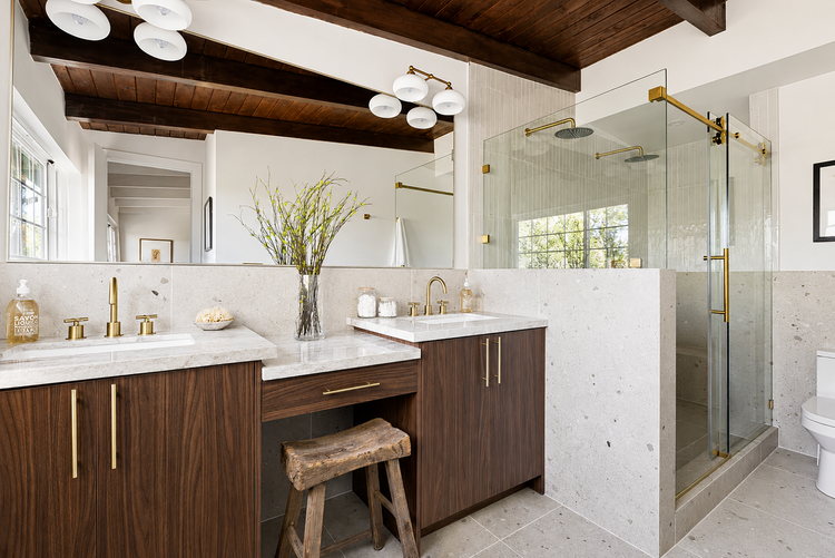 Master bathroom remodel in the San Fernando Valley with walnut double vanity, brass fixtures, and glass walk-in shower