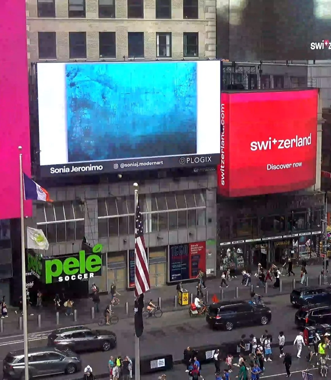 Documentary street view of Drift of Mineral Light by Sonia Jeronimo displayed at 1560 Broadway, Times Square