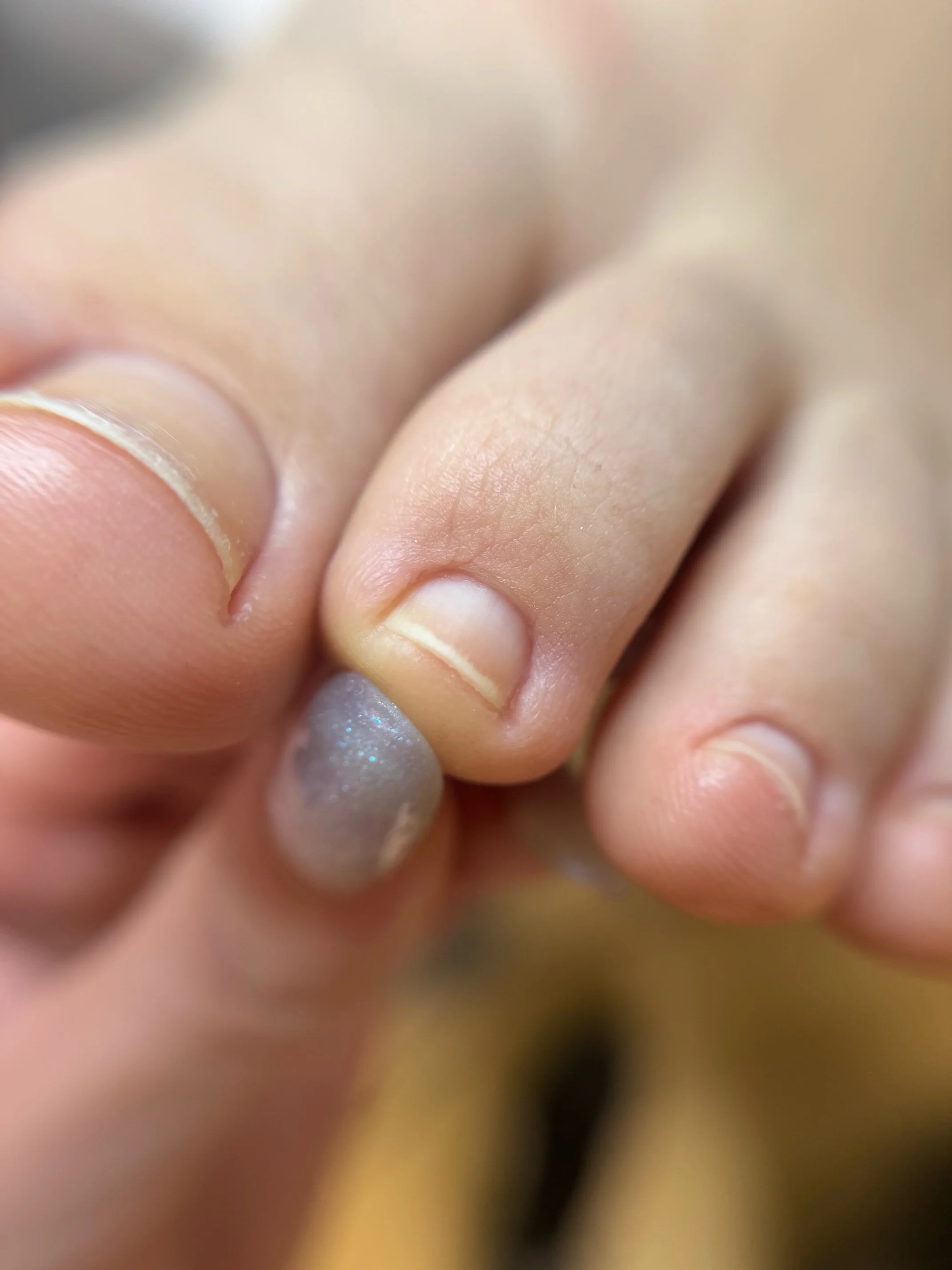 Final result after Jennifer's advanced dry pedicure training, close-up of clean toe detail