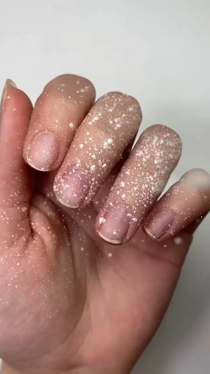 Baby powder applied to natural nails to absorb moisture