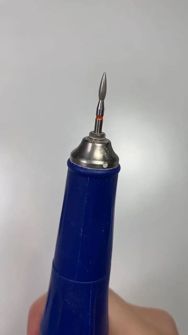 E-file with a fine flame bit prepared for cuticle work