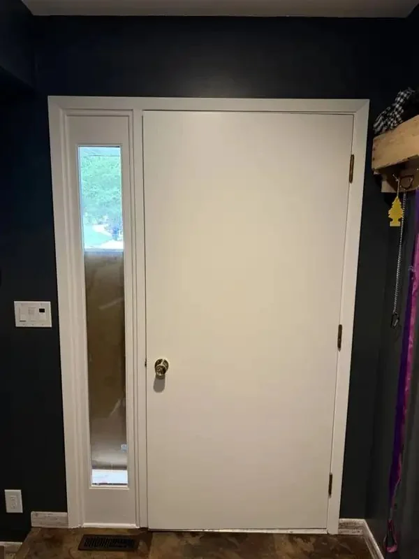 White door and sidelight trim painted by Mission Painting in Norwalk, Iowa