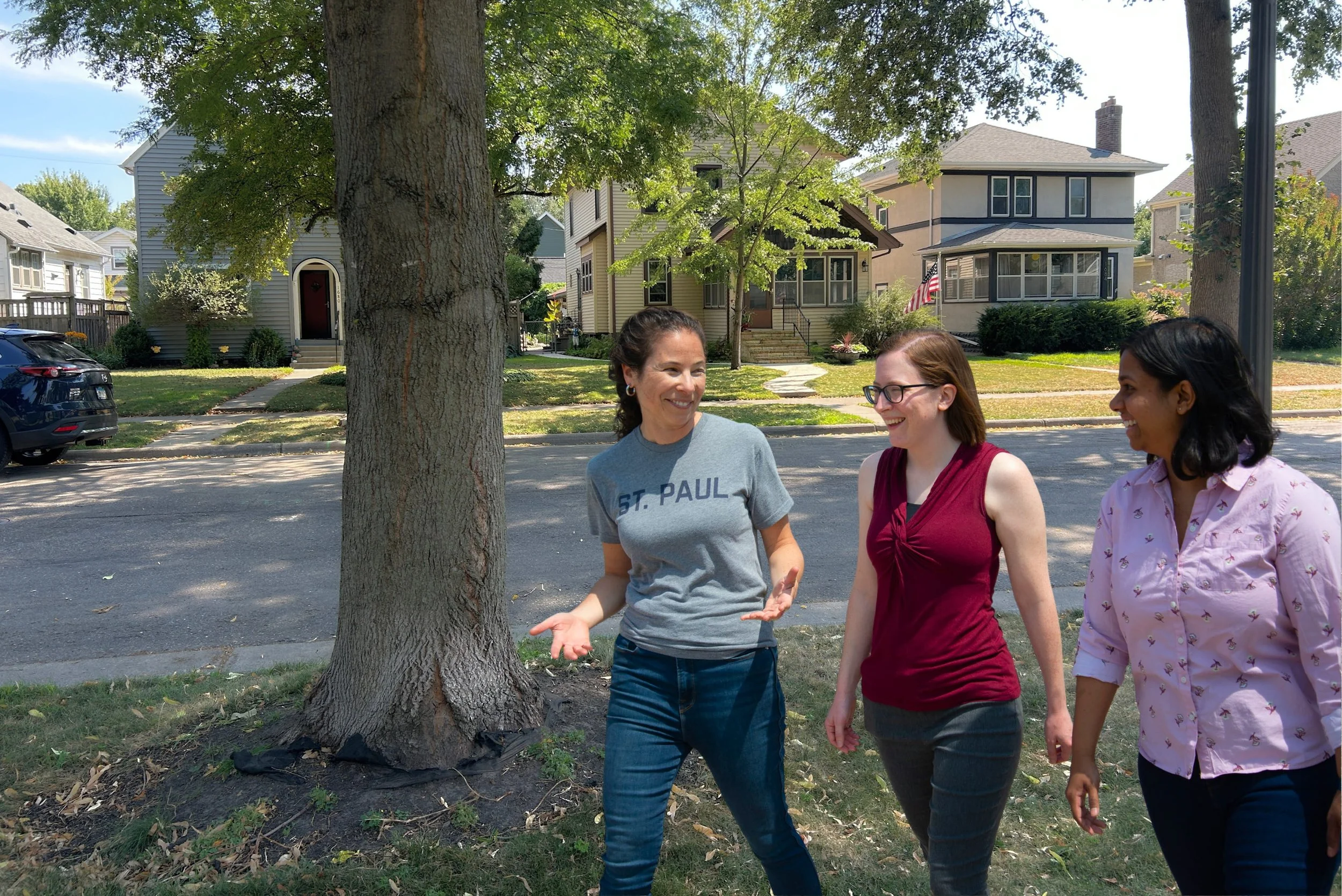 Rebecca Noecker walking with two people on a West Side street