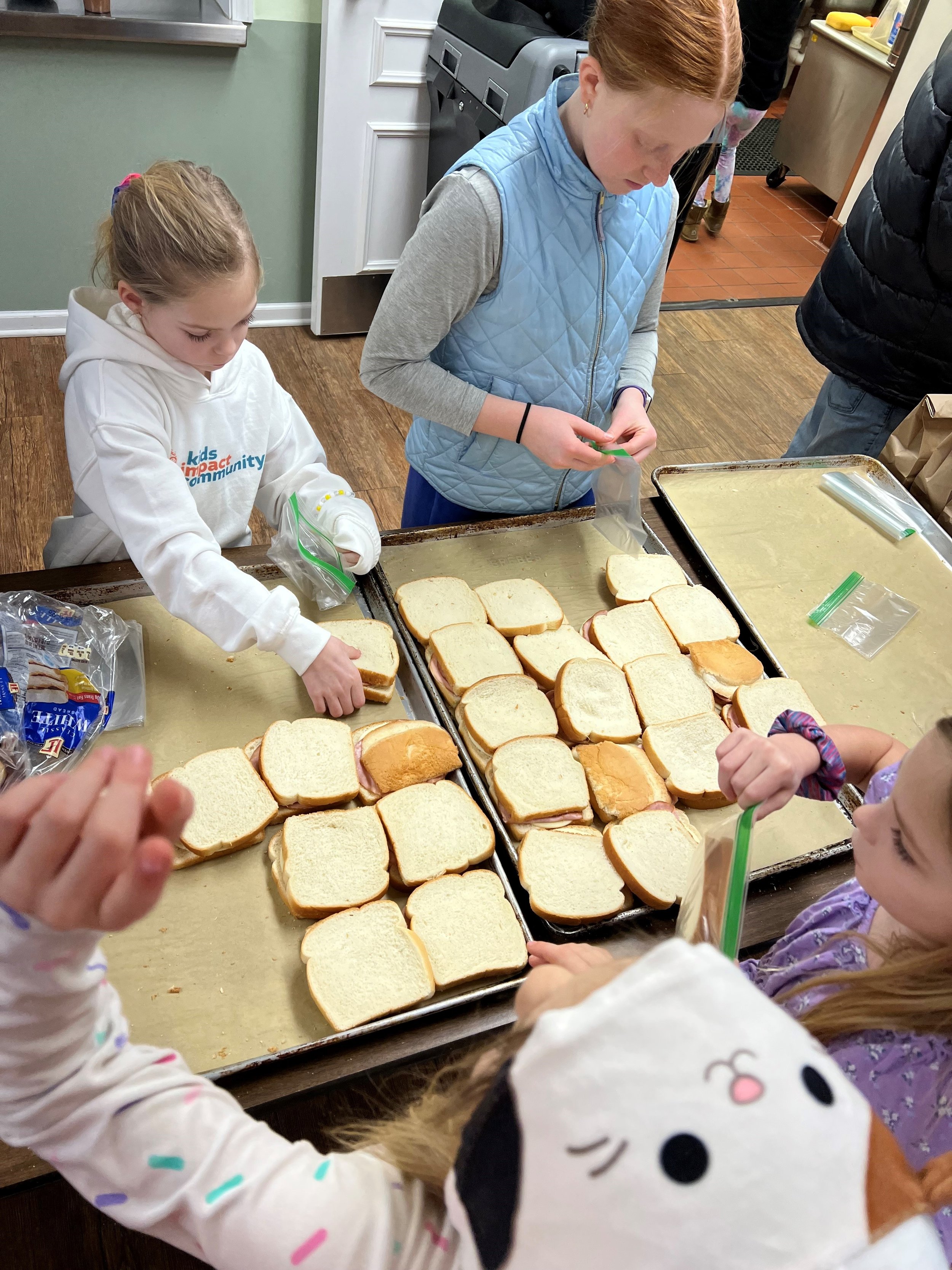 Volunteers preparing bag lunches at North Shore Presbyterian