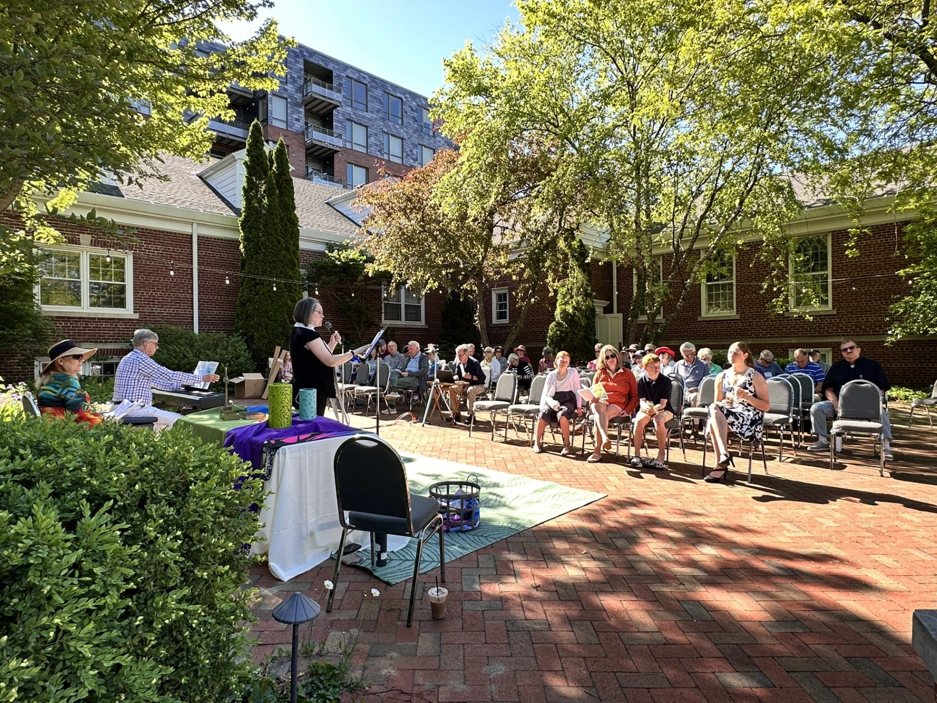 The congregation gathered for an outdoor patio service