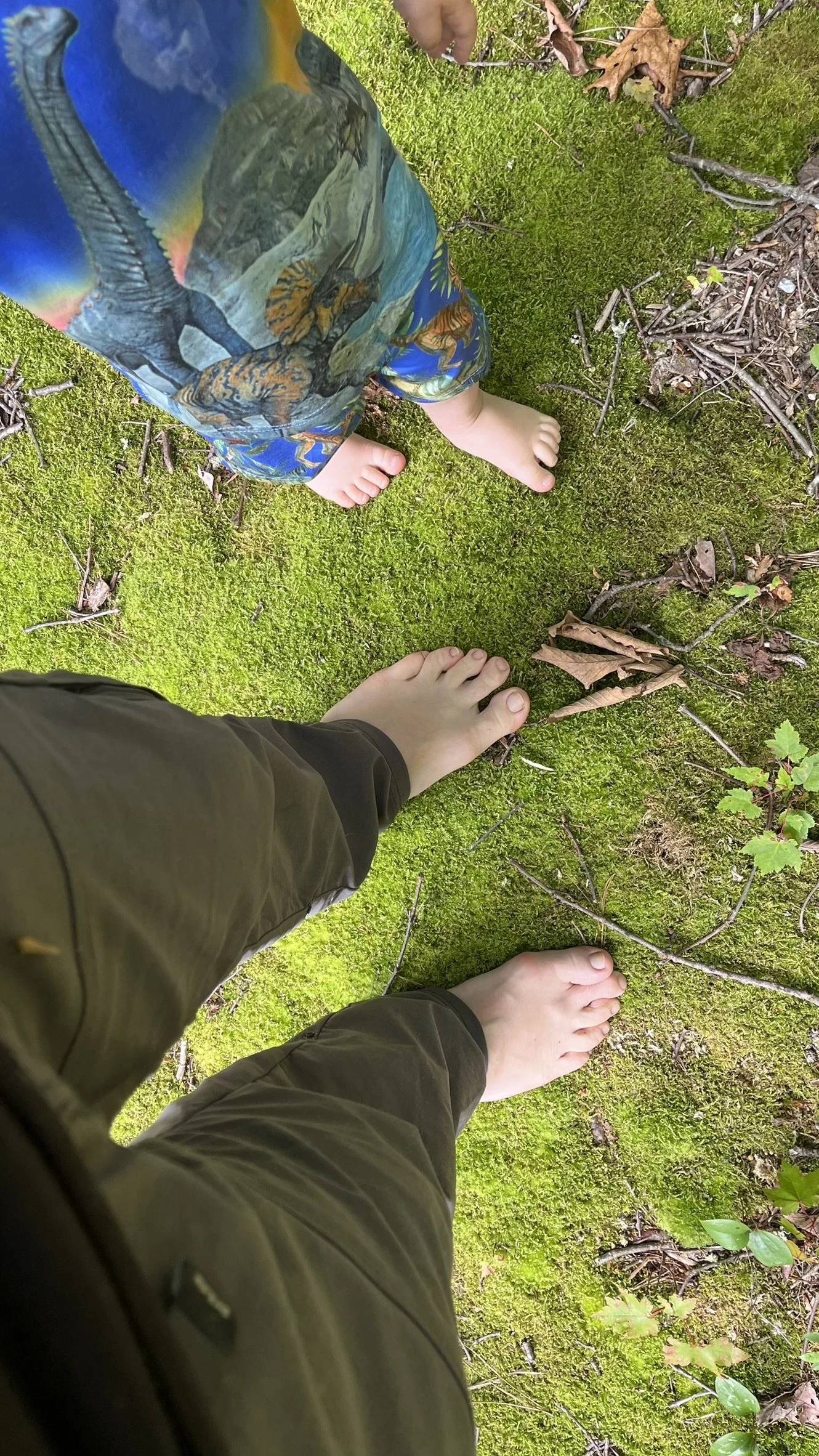 Joseph and son barefoot in nature