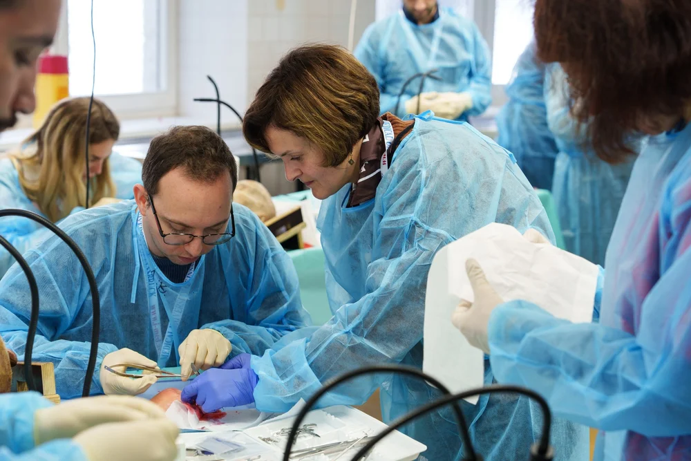 Faculty and participants at a hands-on station