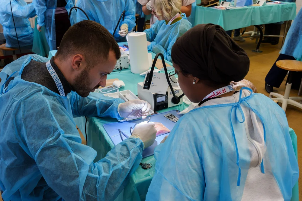 Two surgeons operating on the M.A.R.K.O. LID model