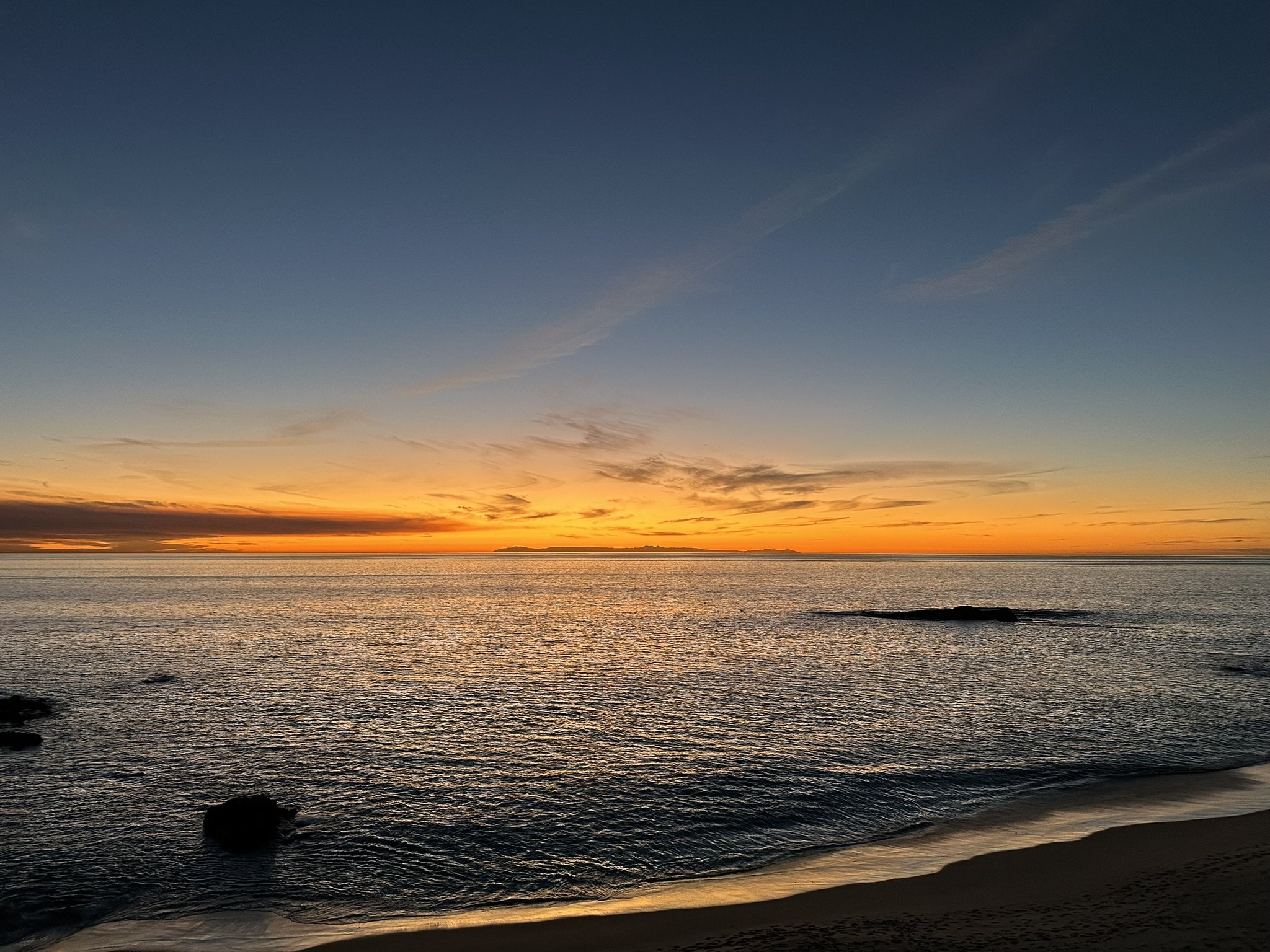 Wide coastal sunset over the Pacific at Laguna Beach