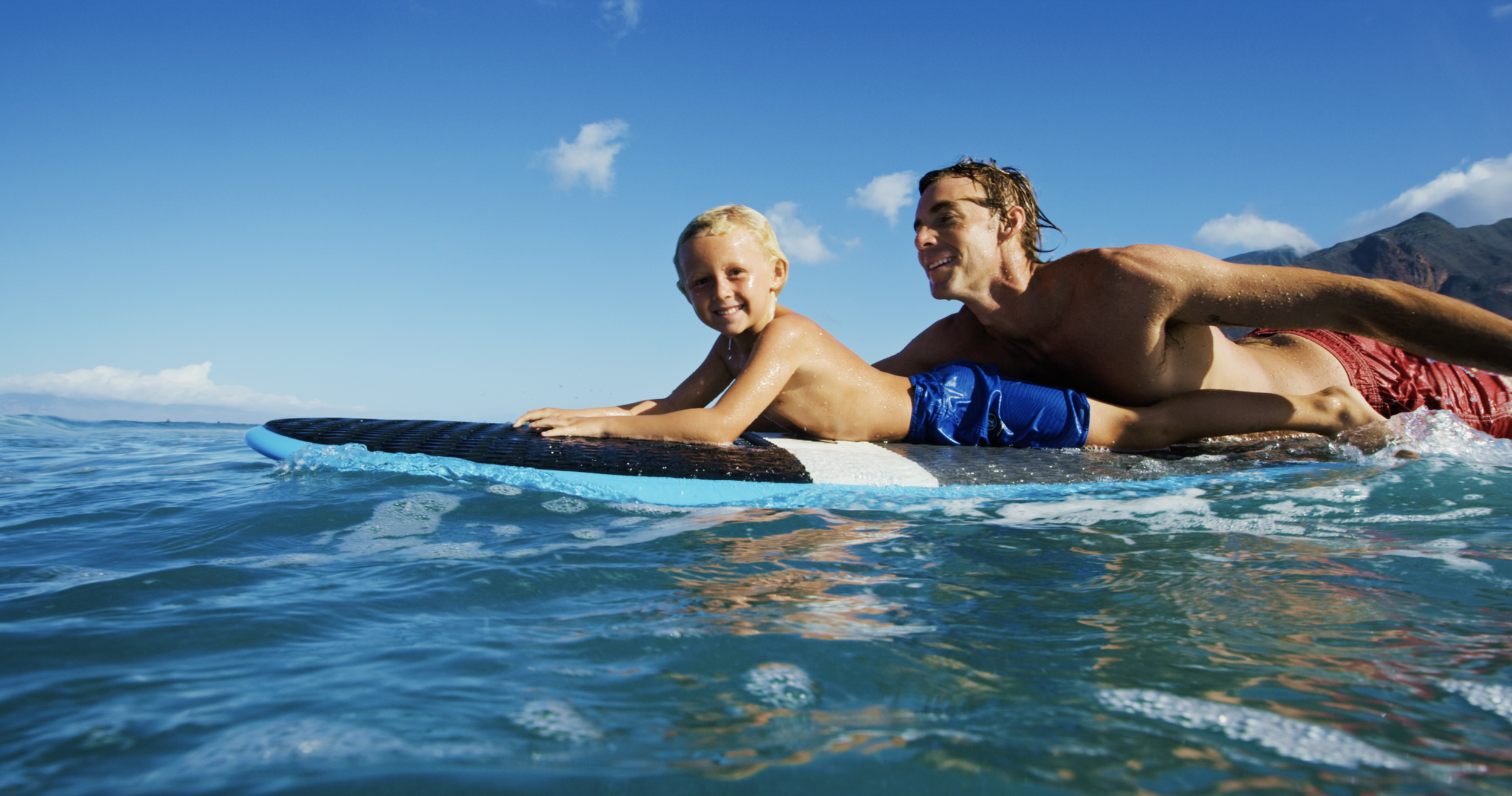 Beginner surfer learning to surf with Makai Surf Club