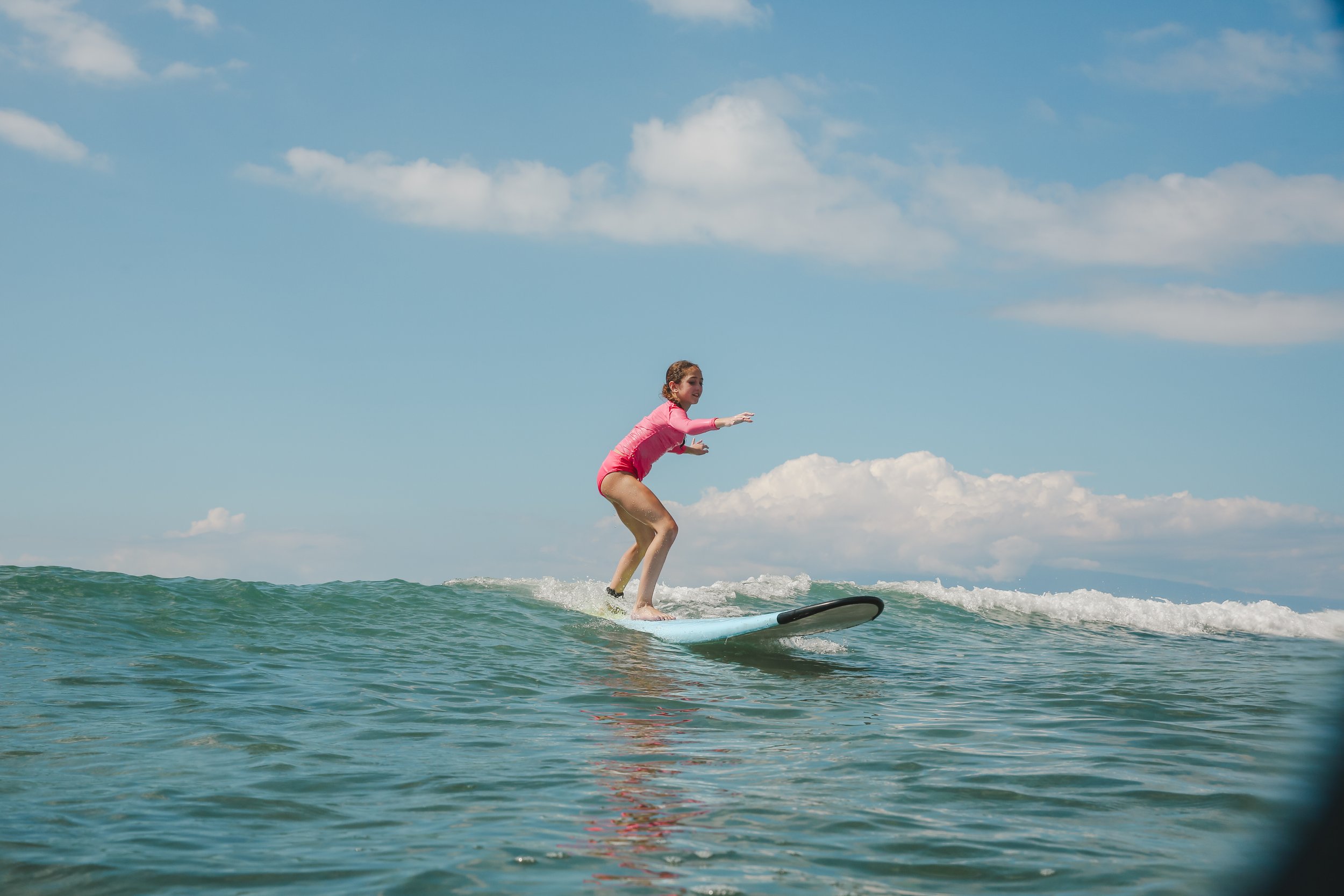 Beginner surfer learning to surf with Makai Surf Club