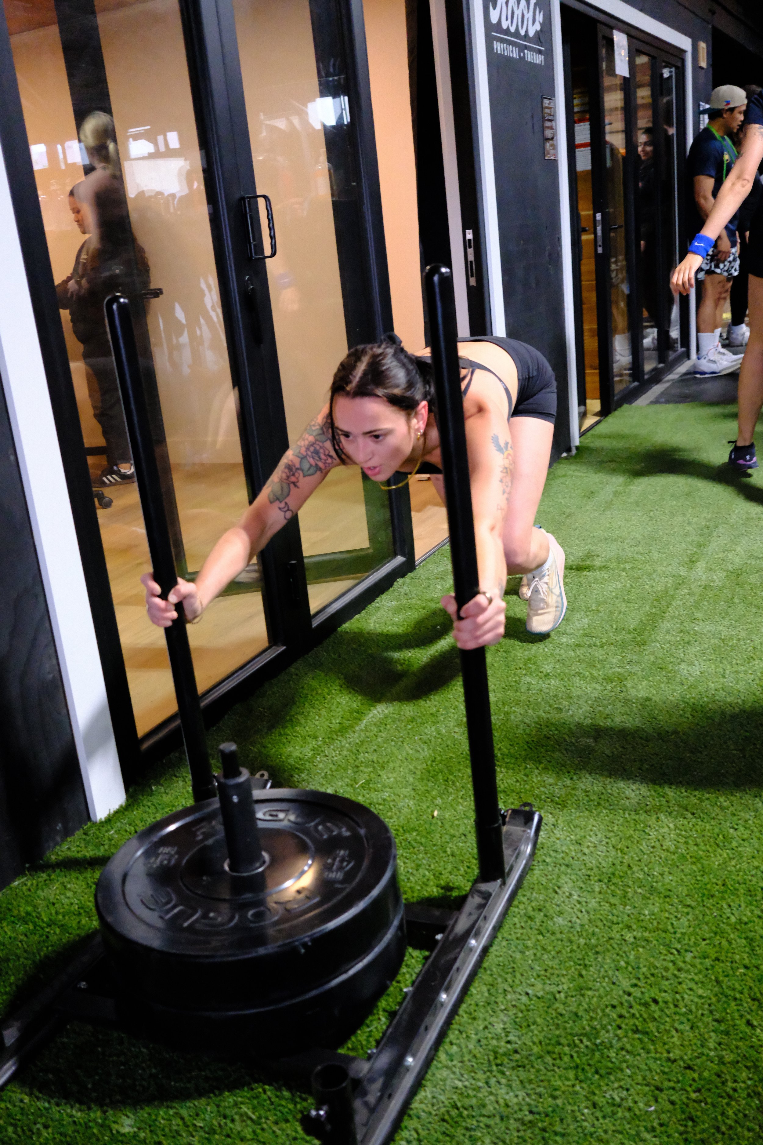 Sled push at race weight on the turf at Root Strength Seattle
