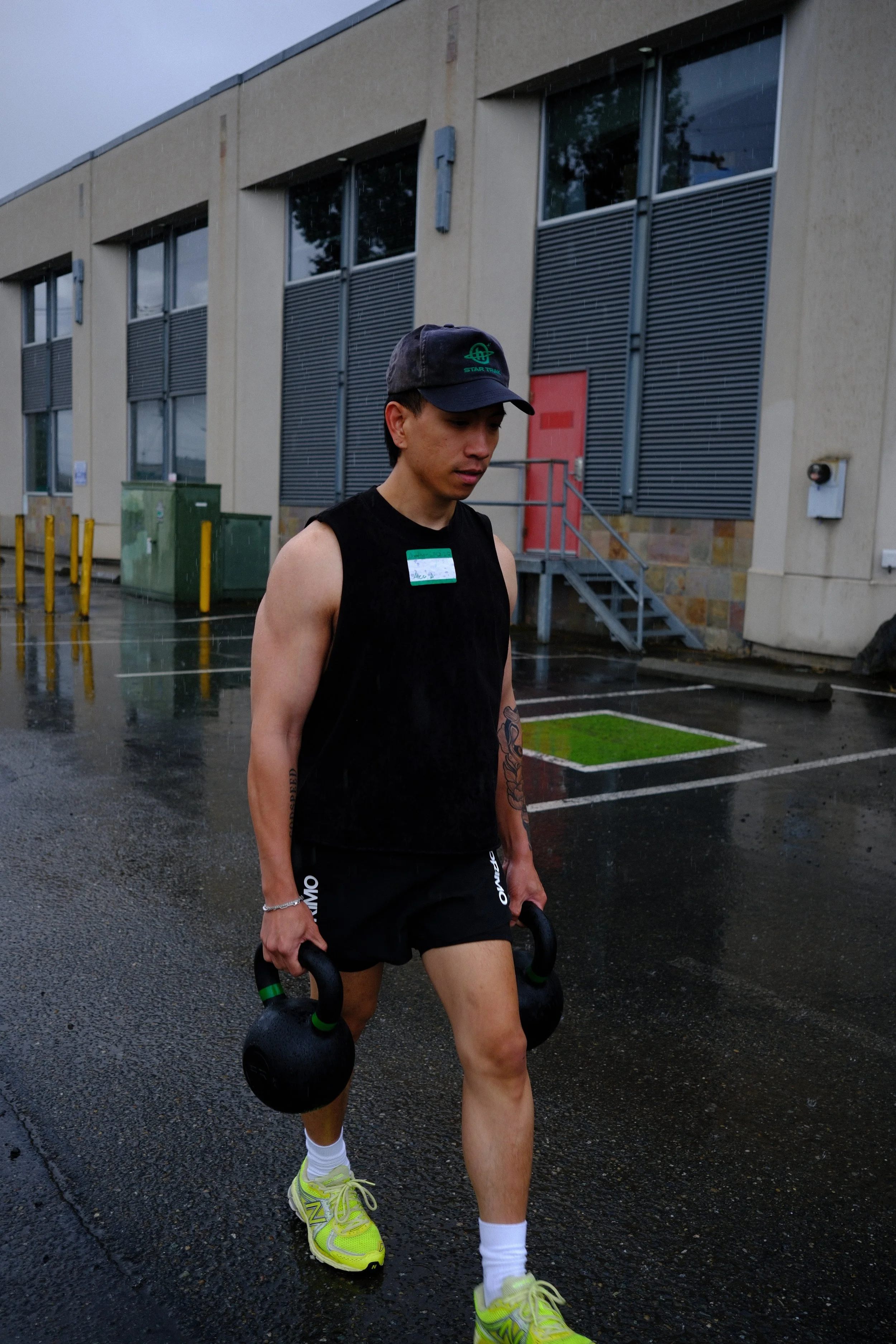 Farmers carry in the rain outside Root Strength Seattle — station 06 training