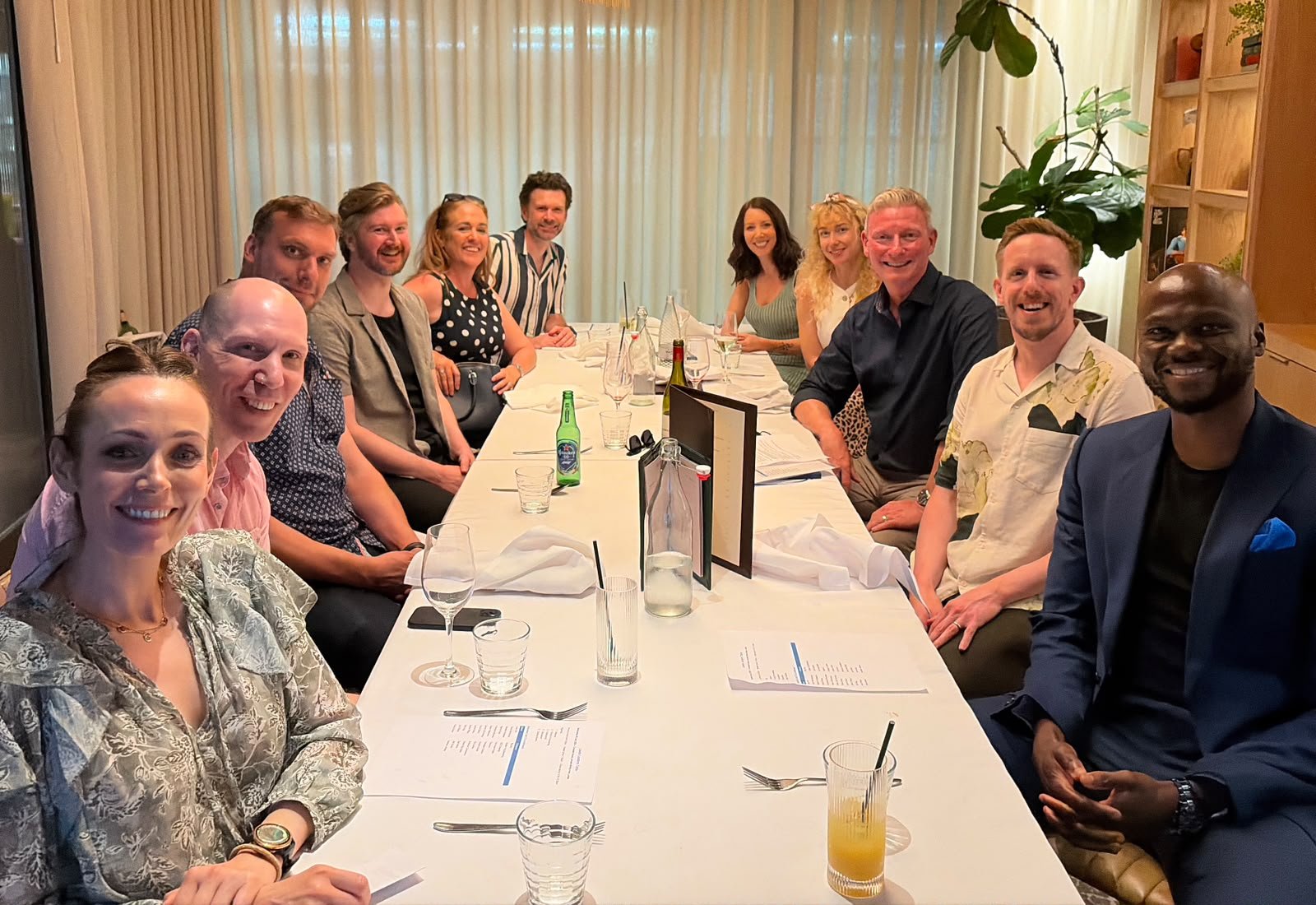 A Leeds Leaders Table dinner, founders smiling around a long table