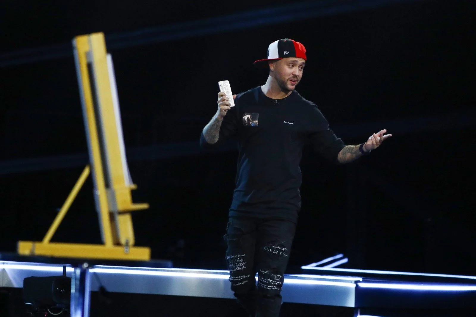 Damien O’Brien performing with playing cards on the Britain’s Got Talent stage