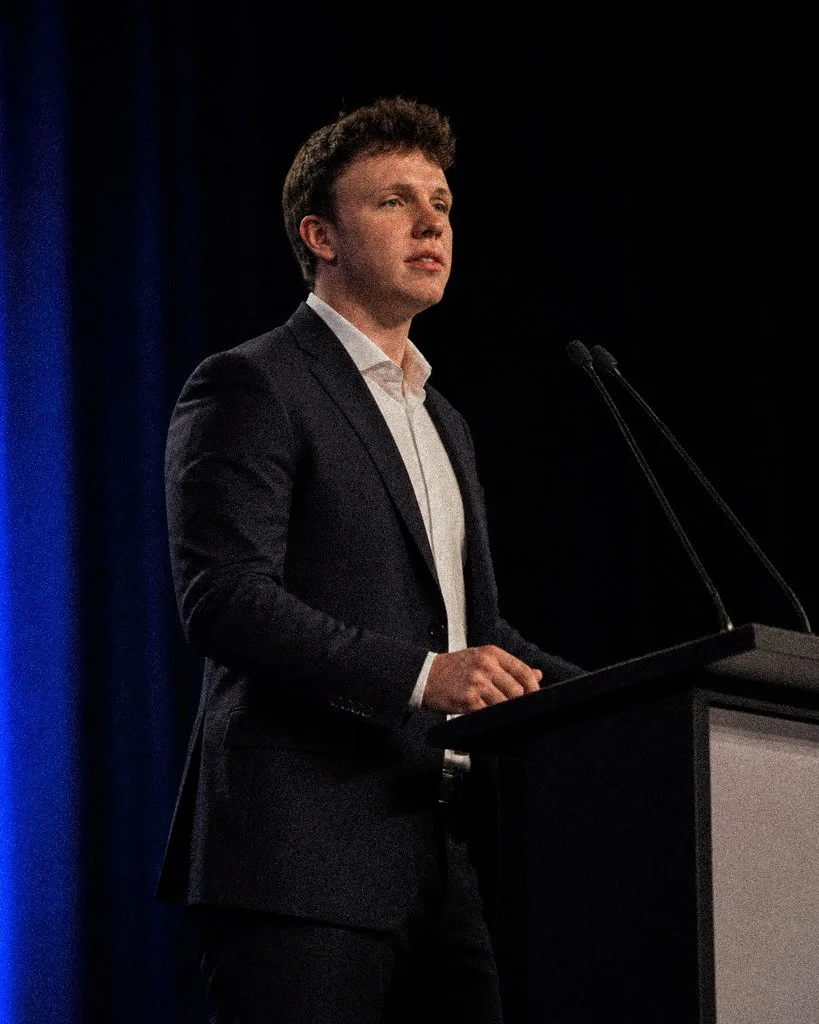 Konner Hancock speaking on stage