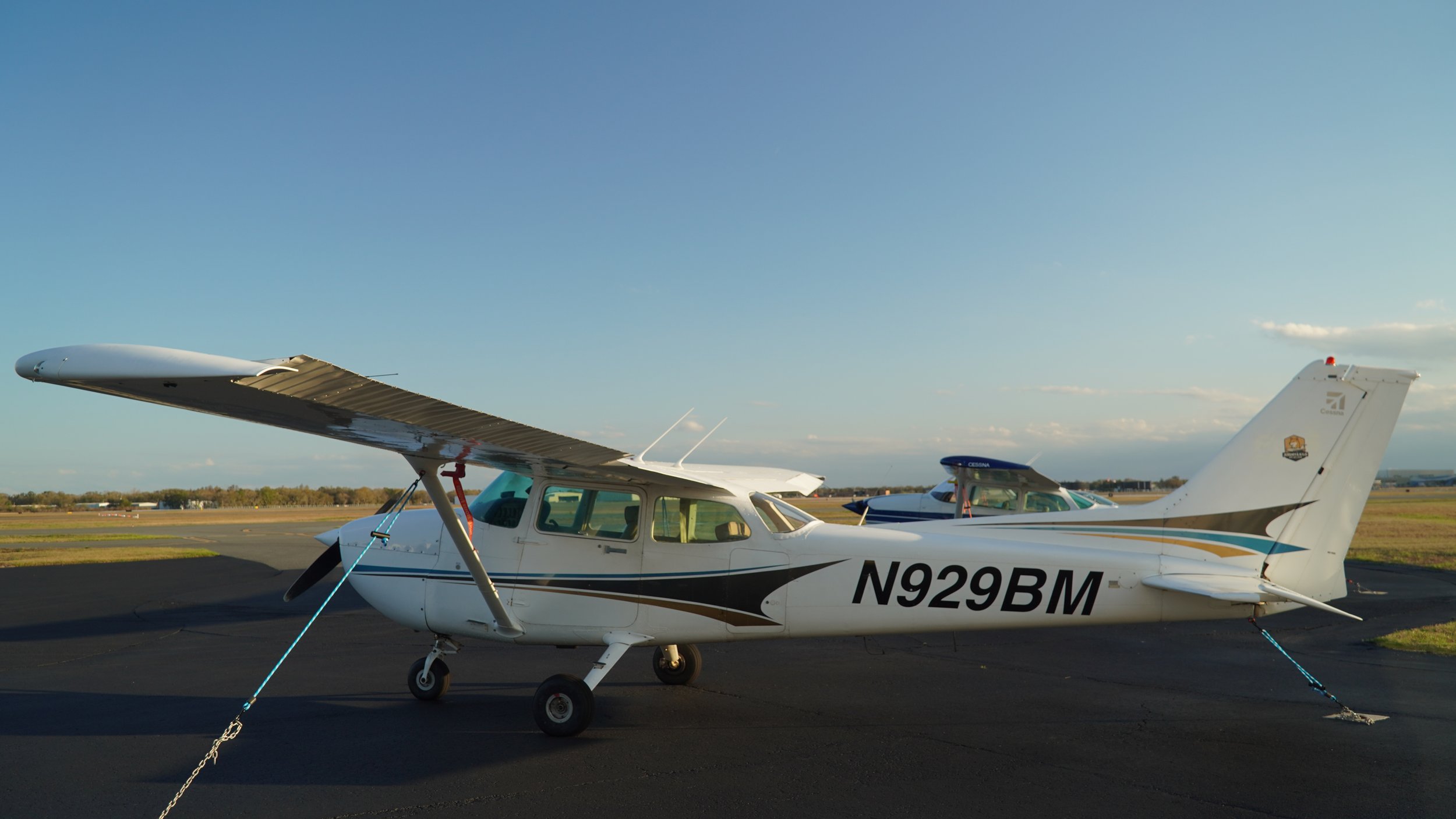 Piper Arrow tail beside a Cessna 172 on the ramp