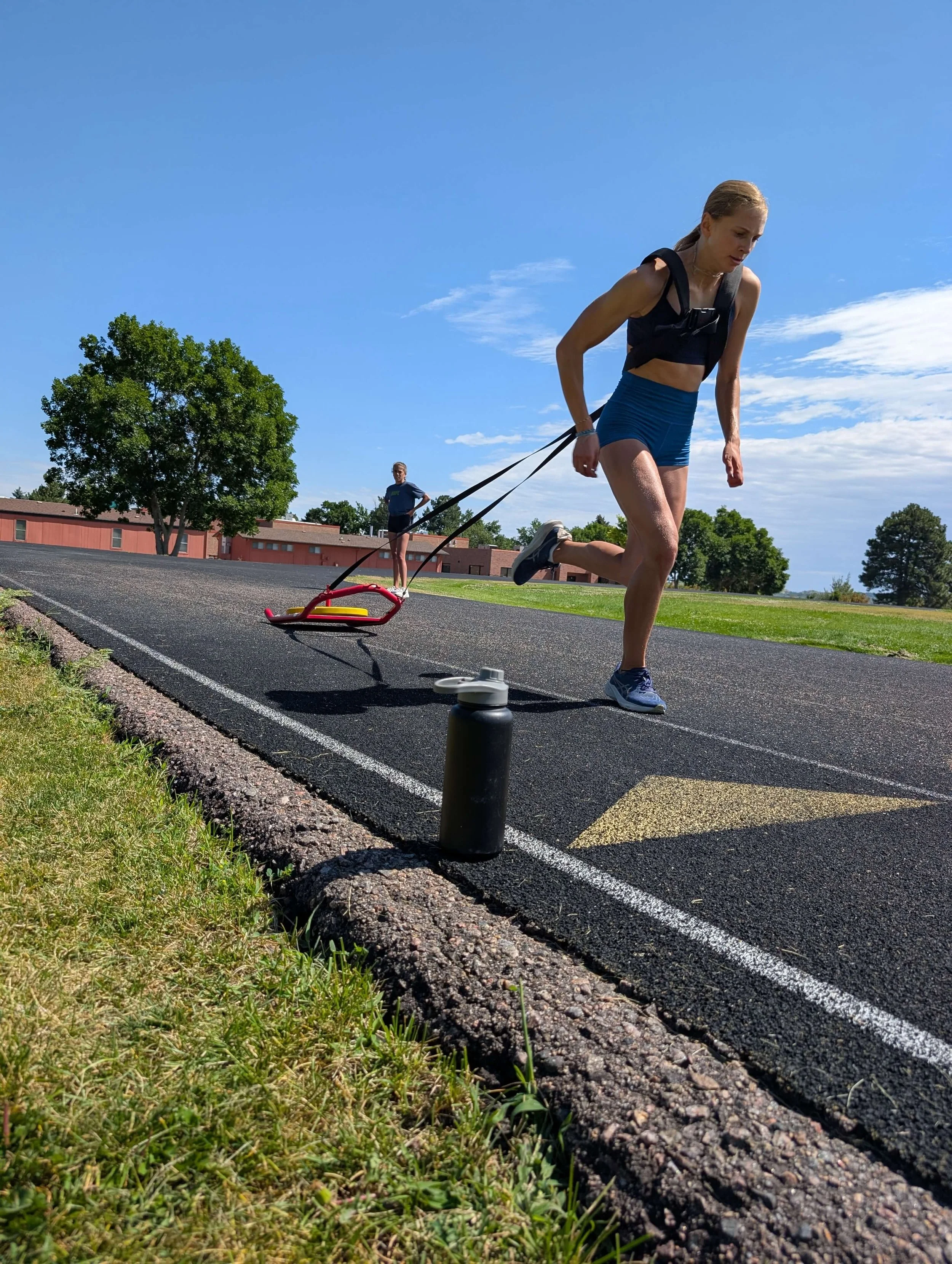 RYFT athlete performing a sled pull during private track and field training