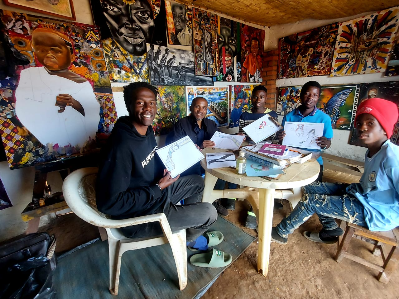 Artists sharing their drawings at Formidable Art Studio, Malawi