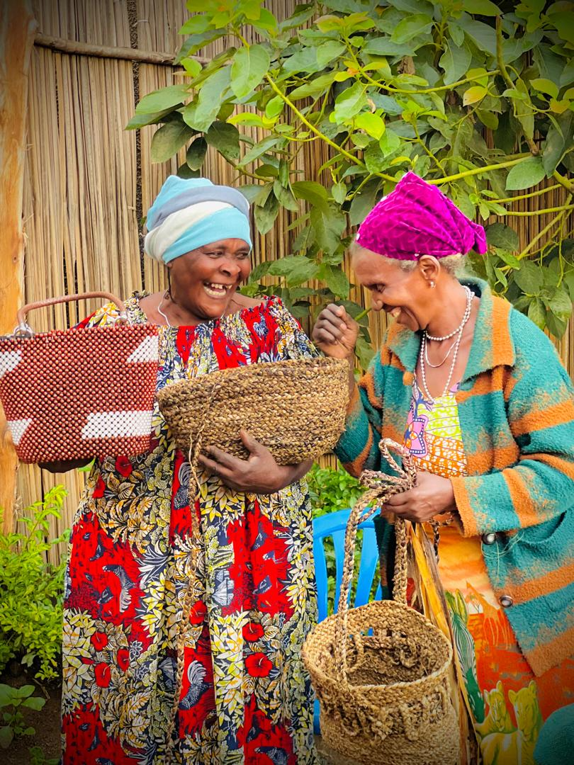 Women weaving together at a partner site