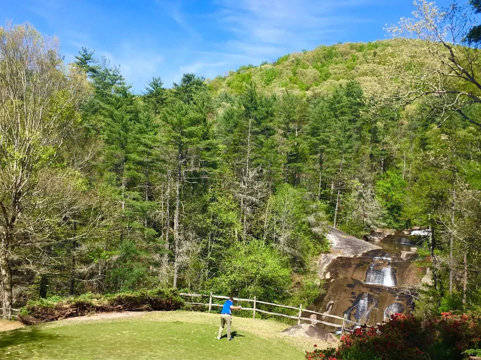 Dramatic elevation changes and the signature 'Waterfall' hole at The Rock Golf Club & Resort, a challenging course near Riverdaze.
