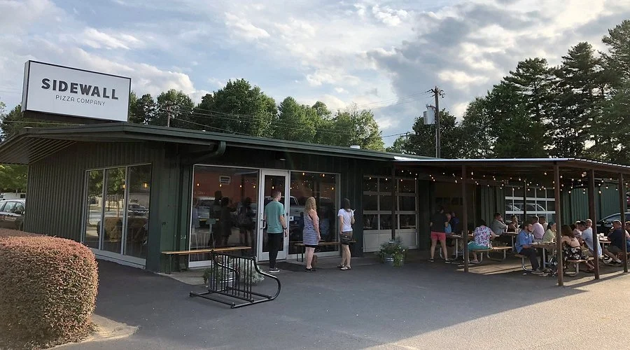 Brick-oven pizzas and homemade ice cream at Sidewall Pizza Company, a local obsession in a renovated tire shop near Riverdaze.