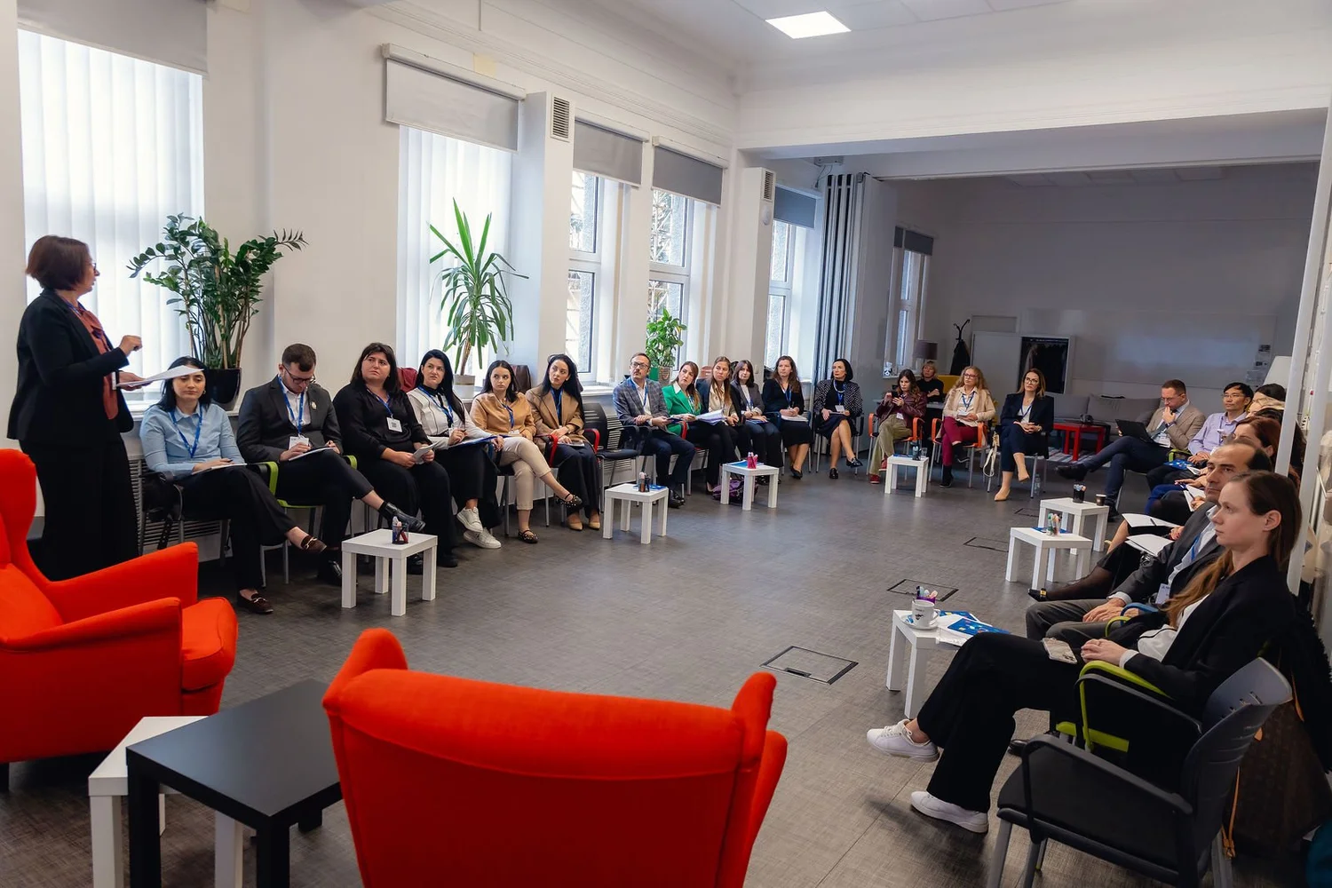 Participants seated in a circle during a CEF training session in Ljubljana.